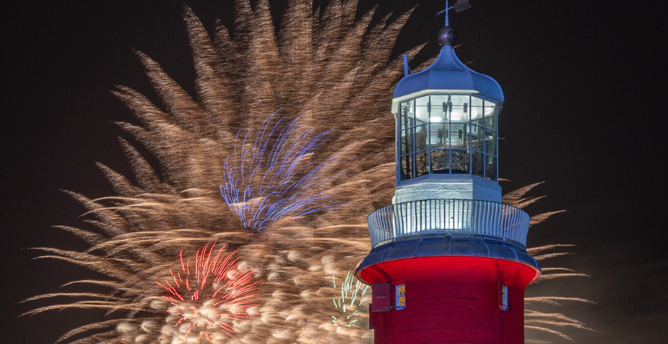 Fireworks behind Smeaton's Tower during British Firework Championships